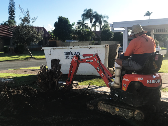 tree stump and brick fence removal